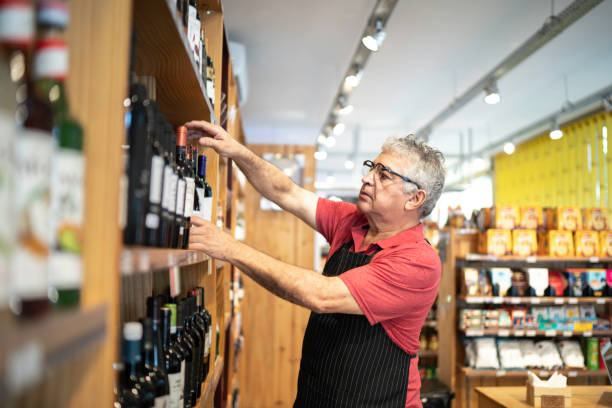 Employee checking products in a store agence web boulangers Lyon