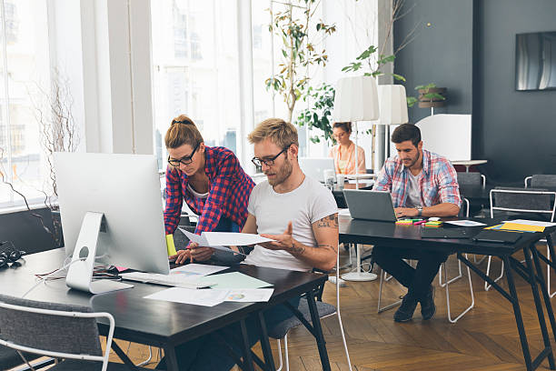 Young business people working at office on new project