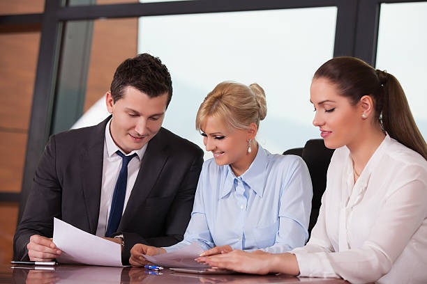 Group of happy business people in a meeting at modern office agence web Arts-et-Métiers