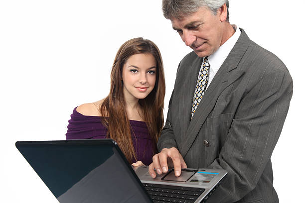 Business team working on laptop in front of white background agence web Sentier