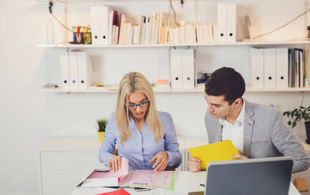 Business man and woman working together in the office agence web Saint-Michel