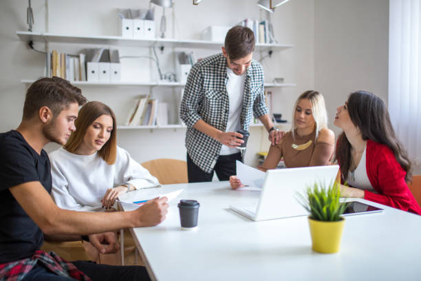 Group of young colleagues sitting and working in modern office agence gentleview. communication digitale lyon