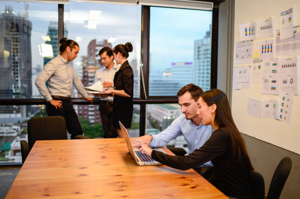 business man and business woman discuss idea at business meeting in office