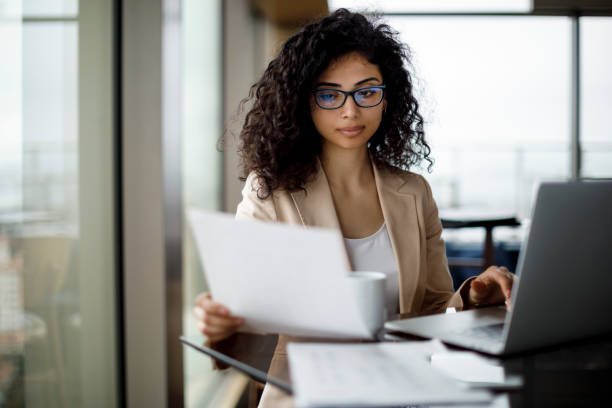 Young businesswoman preparing for business meeting naming entreprise